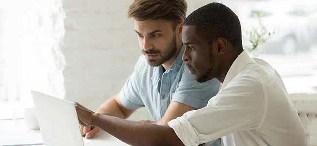 Binary Options Online Training 2 two man looking at computer